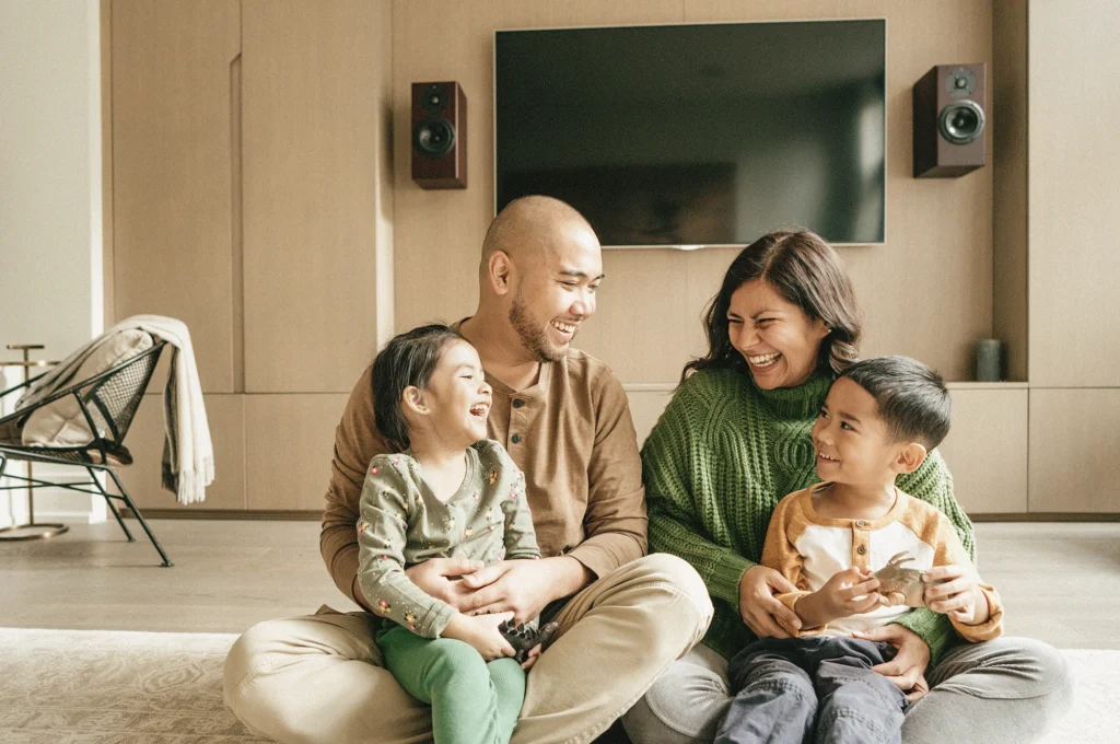 Photo of a family in the living room for client CHM