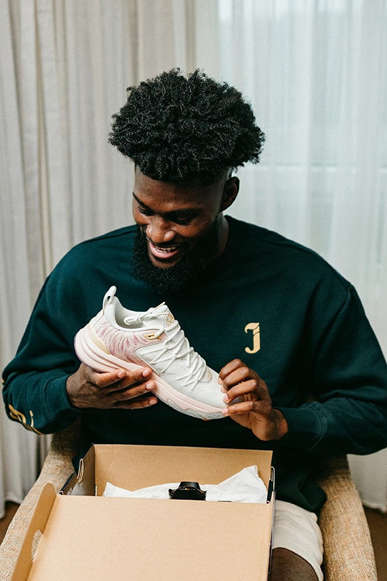 Jonathan Isaac holding a Judah1 Low